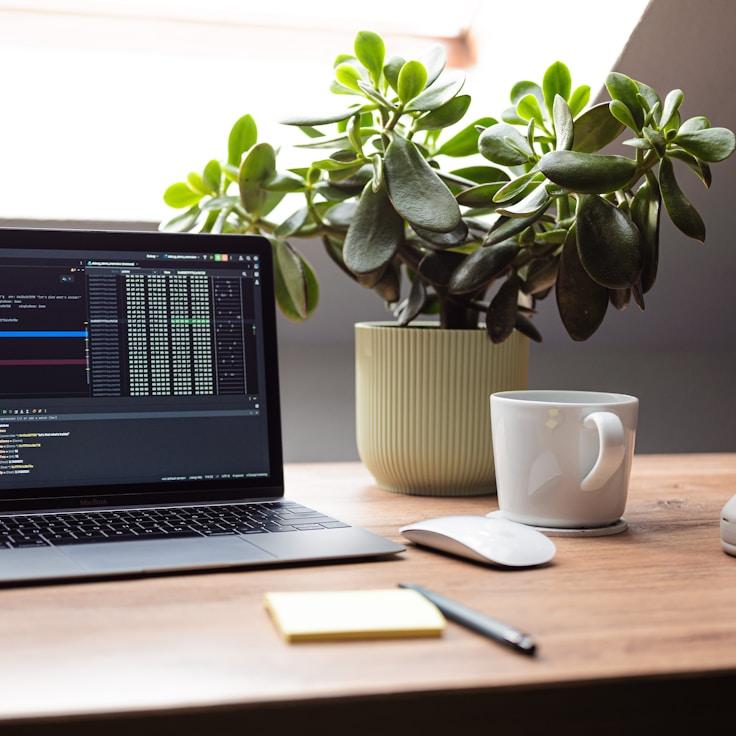 Mobile app project planning workspace with devices and development tools